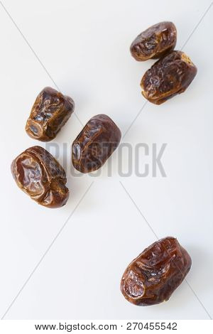 Dried Dates (fruits Of Date Palm Phoenix) On A White Background.