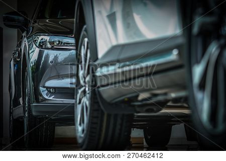 New Luxury Black Shiny Suv Compact Car Parked In Modern Showroom. Car Dealership Office. Car Retail 