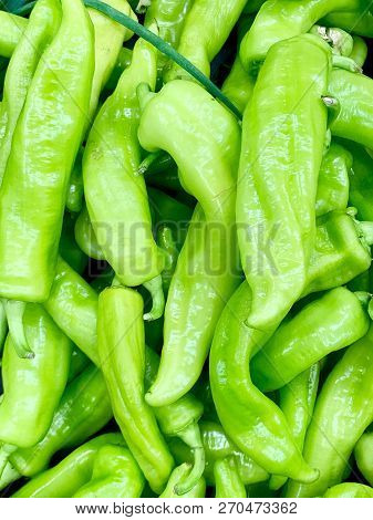 A Very Detailed Close Up Of Fresh Green Peppers. The Light Green Colour Is Vivid And Shining.
