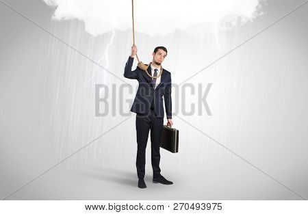 Young businessman trying to suicide with pointing hands concept
