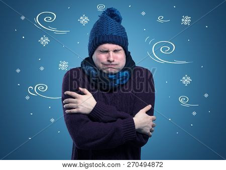 Young hipster frozen boy with doodled snowflakes and windy concept