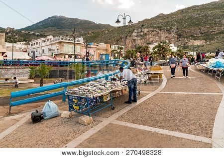Sferracavallo, Sicily, Italy - October 1, 2018: Waterfront Promenade With People Enjoying The Aftern