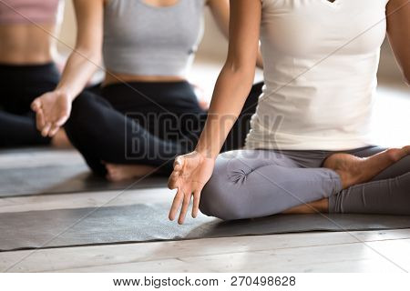 Black Woman And Group Of People Practicing Yoga, Half Lotus