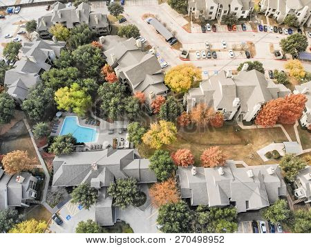 Aerial View Apartment Building With Swimming Pool And Colorful Fall Foliage