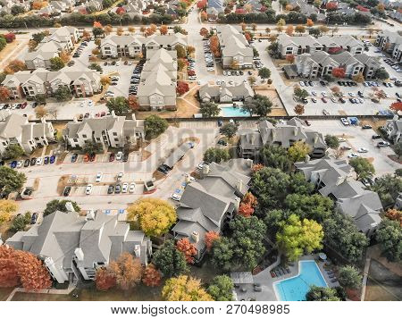 Aerial View Apartment Building With Swimming Pool And Colorful Fall Foliage