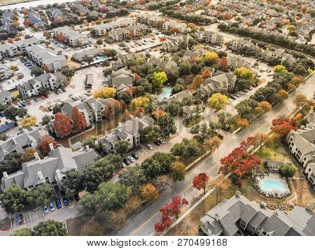 Top View Apartment Complex Near Riverside Residential Area With Colorful Autumn Leaves