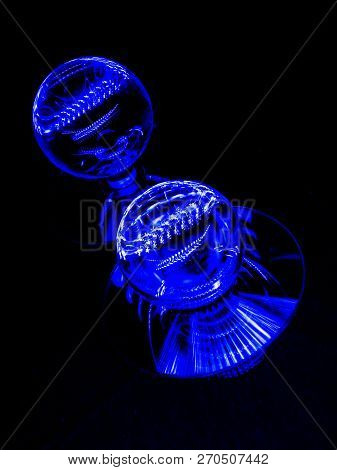 Twin Lensballs Sitting On Flat Reflective Discs.