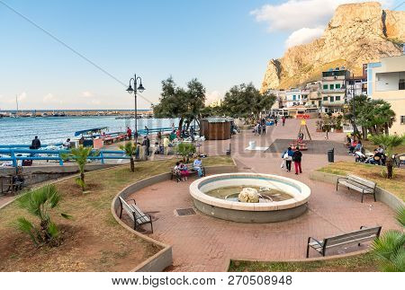 Sferracavallo, Sicily, Italy - October 1, 2018: Waterfront Promenade With People Enjoying The Aftern