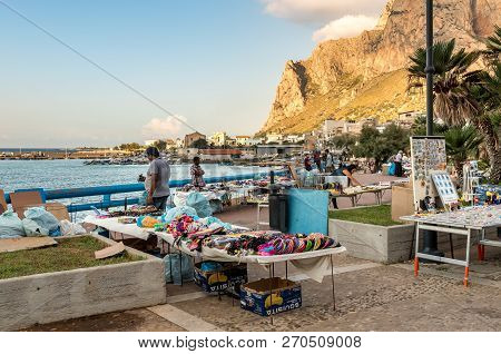 Sferracavallo, Sicily, Italy - October 1, 2018: Waterfront Promenade With People Enjoying The Aftern