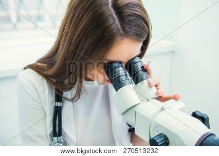 Close Up Woman Gynecologist Working With Colposcope And Makes Microscopic Investigation In Clinic. S