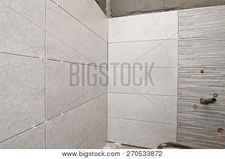 Repair The Bathroom. Renovation At Home Unfinished Ceramic Tiles With Spacers