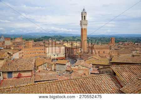 Over The Roofs Of Siena On A September Cloudy Day. Italy