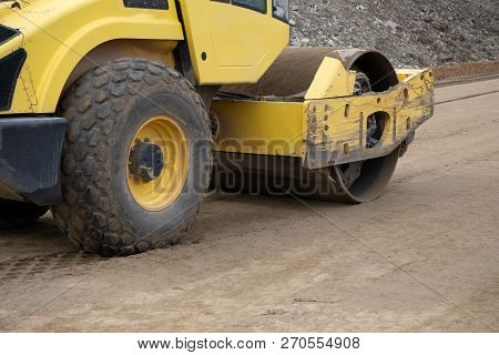Vibratory Soil Compactor Working On Highway Construction Site