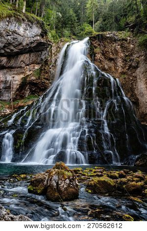 Beautiful View Of Famous Gollinger Wasserfall With Mossy Rocks And Green Trees, Golling, Salzburger 