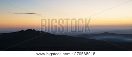 Beautiful Sunset Silhouette Landscape Image Of Foggintor In Dartmoor