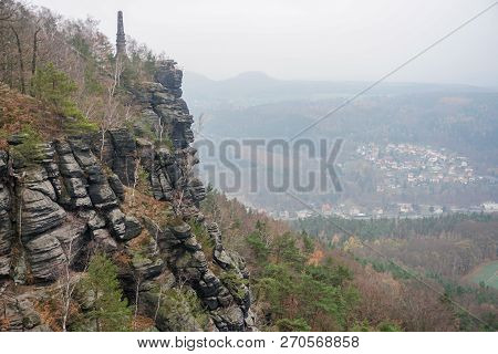 Natureview With A Rock And A Town