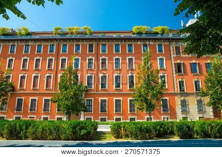 Orange Multi-storey Buildings With Rows Of Windows, Milan, Italy