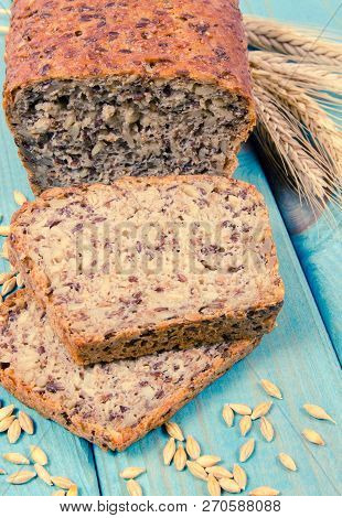 Multi-grain Bread On A Wooden Background. The Source Of Fiber, Complex Carbohydrates, B Vitamins And