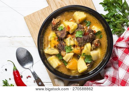 Goulash With Meat And Vegetables On White Wooden Table. Beef Stew With Vegetables. Top View With Cop