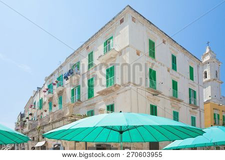Molfetta, Apulia, Italy - Turquoise Sunshades And Lattice Blinds In The Streets Of Molfetta