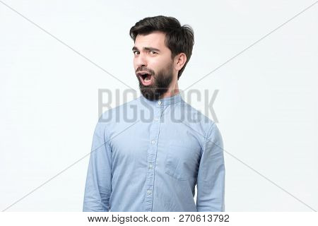 Young Funny Hispanic Man With Black Beard Is Shocked And Suprised.