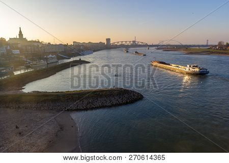 Nijmegen, The Netherlands - November 16 2018: Cargo River Barges Passing Near Nijmegen During Time O