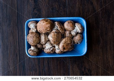 Portobello Raw Cremini Mushrooms In Plastic Container Package Or Box.