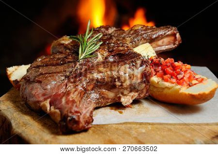 Delicious Piece Of Meat Roasted On A Background Of Fire