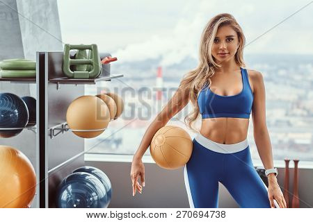 Sexy Girl With A Fitness Ball In The Gym.