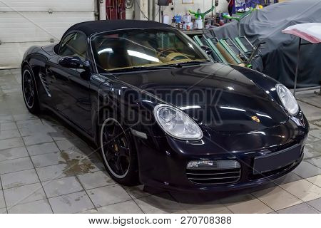 Novosibirsk, Russia - 08.01.2018: Black Porsche Boxster S 2006 Release Front View On The Car Parking