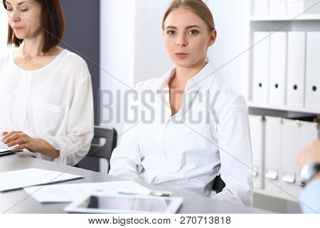 Group Of Business People Or Lawyers Discussing  Terms Of Transaction In Office. Colleagues Working A