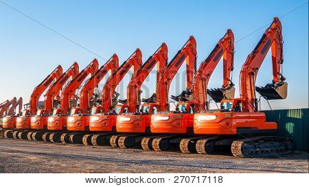 A Complect Of New Excavators Sold And Parked Awaiting Shipment By Rail