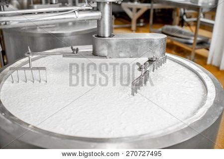 Milk Mixing In The Stainless Tank During The Fermentation Process At The Cheese Manufacturing