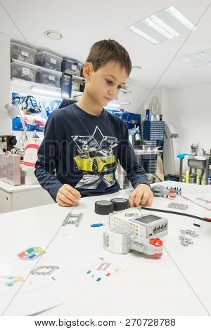 Vilnius, Lithuania - November 16, 2018: Kid Making Lego Robot Mindstorms. Robotic, Learning, Technol