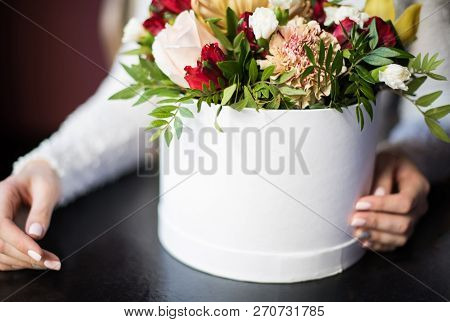 Fragment. The Girl In White, The Bride, Holding A Round White Box With Beautiful Flowers