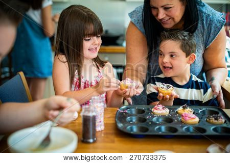 Family with fresh homemade cucakes