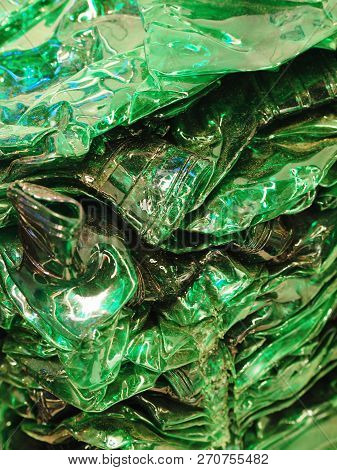 Nuremberg, Germany - November 13, 2018: Crushed Green Plastic Bottles For Recycling