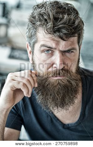 Hipster Brutal Guy Twisting Mustache. Man Confident Brutal Bearded Macho. Grooming And Barber Shop C