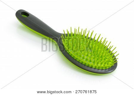 Gray With Green Hairbrush With Plastic Bristles On A White Background