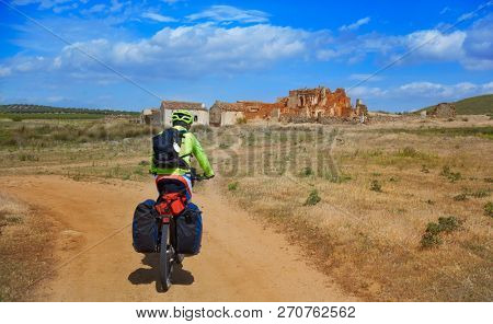 Biker pilgrim in Castile La Mancha on Saint James Way of spain Camino de Santiago