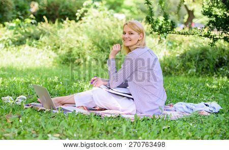Woman With Laptop Sit Grass Meadow. Best Jobs To Work Remotely. Business Lady Freelance Work Outdoor
