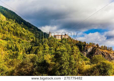 Warm autumn in the Dolomites, the Val de Funes. The valley is surrounded by a wall of dolomite rocks. The concept of ecological tourism