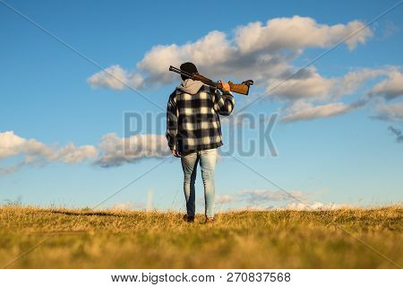 Hunter With Shotgun Gun On Hunt. Closed And Open Hunting Season