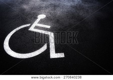 Disabled People Icon Or Handicap Symbol On Parking Space.sign Design On Urban Asphalt Road.wheel Cha