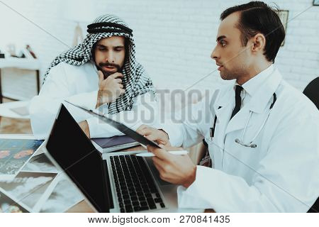Muslim Man Having Consultiation Doctor Therapist. Young Patient Having Consultation At Clinic. Recep