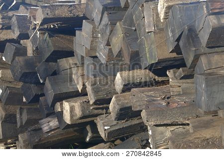 Train Track Logs In A Large Pile