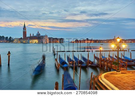 Gondolas On Grand Canal And San Giorgio Maggiore Church In Venice