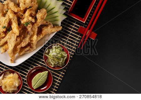 Fried Fish Fingers On Black Background