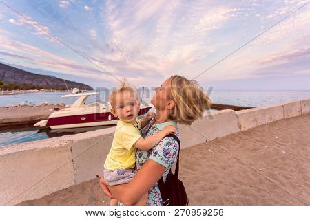 Woman Playing With Her Baby Outside. The Concept Of A Happy Full-fledged Family Life. Games With A C
