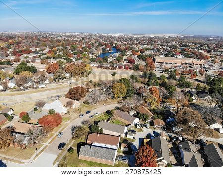 Top View Residential Neighborhood With Lake, Pond And Colorful Fall Foliage In Texas, America